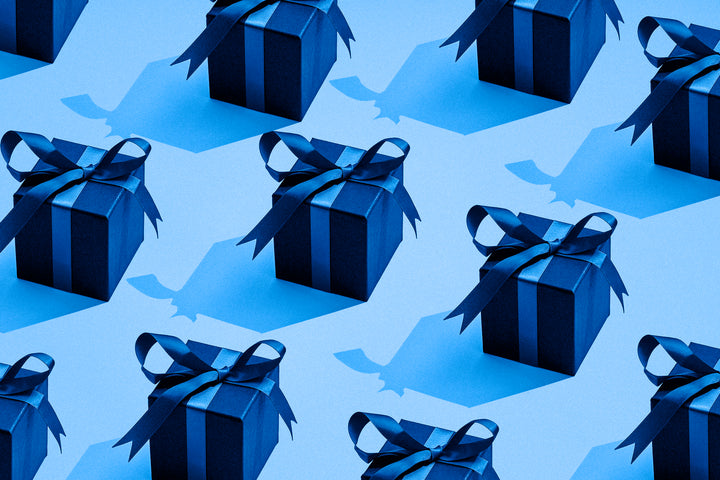 Collection of blue wrapped presents with ribbons.