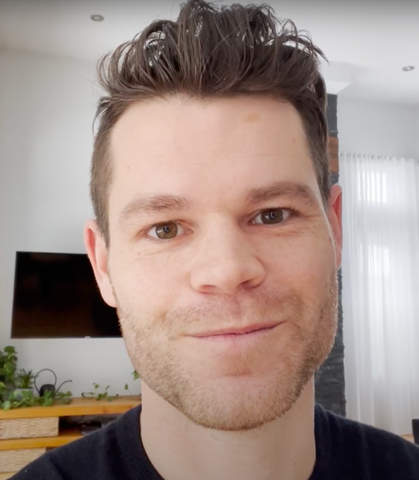 Guy with gelled hair gazing into the camera