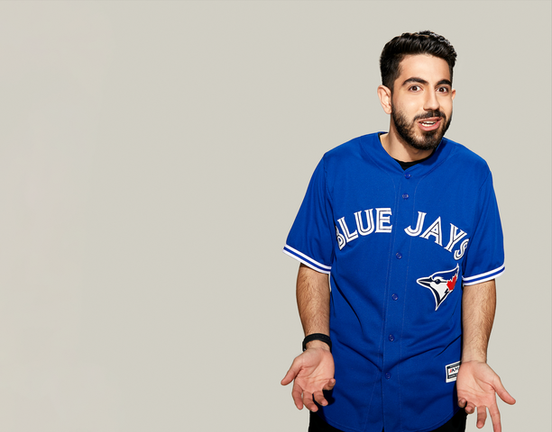 Jesse making a face for the camera in a Toronto Blue Jays jersey