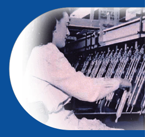 woman in factory using electronic testing