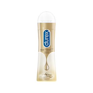 EN Bottle of Durex Real Feel lube stands tall./ FR Une bouteille de lubrifiant Durex Real Feel en position verticale