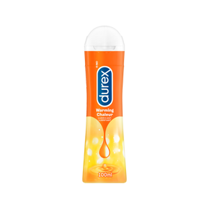 A 100 ml bottle of Durex Warming Lubricant on a beige background.